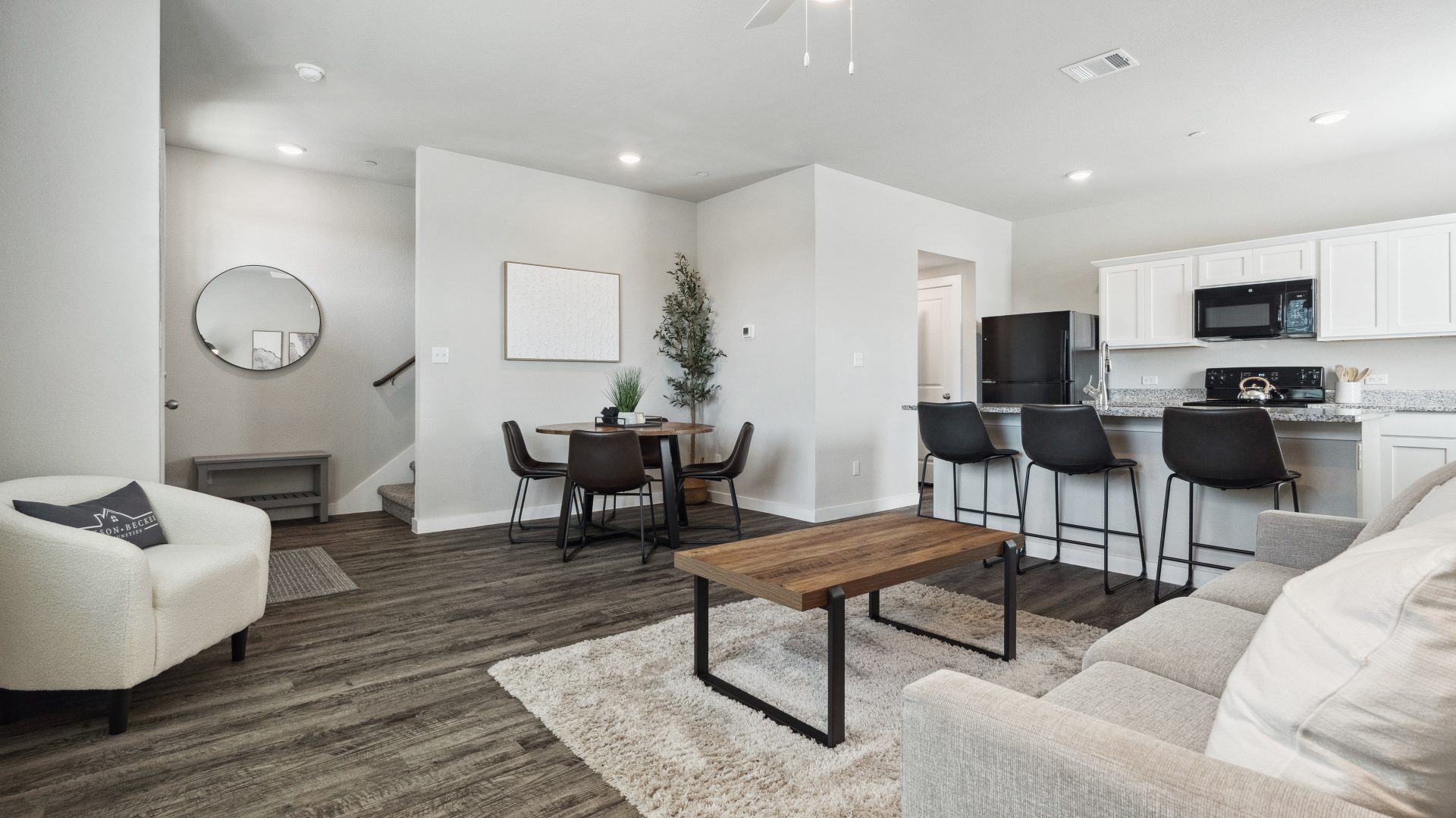 the living room and kitchen area of a home at The  Powell