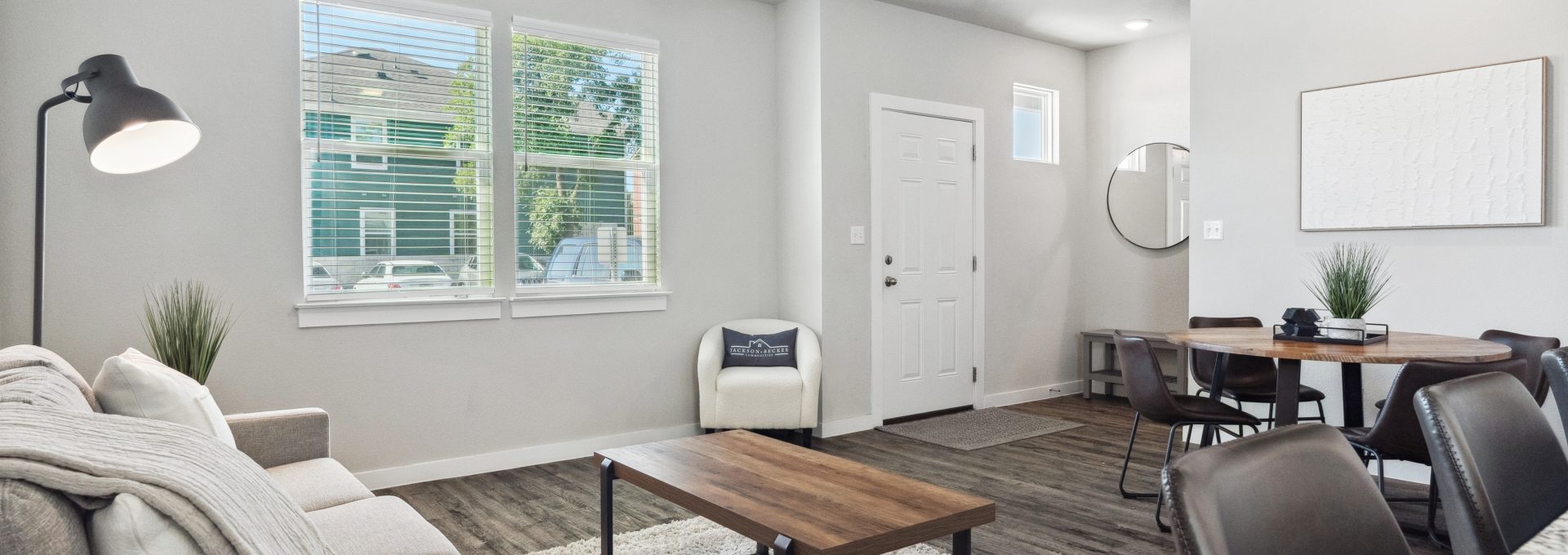 a living room with a couch, coffee table and television at The  Powell