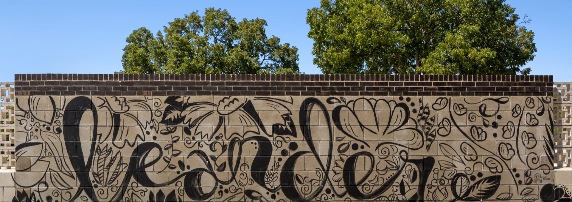 a large mural with black and white writing on it at The  Powell