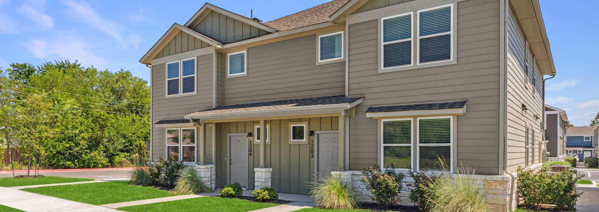 Exterior view of a two-story townhome in The Powell's community