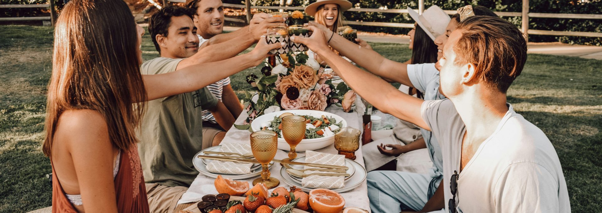 people sitting on chair eating food during daytime